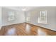 Hardwood floor bedroom with two windows and ceiling fan at 882 Edgewater Trl, Atlanta, GA 30328