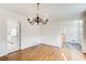 Hardwood floor dining room, chandelier, view to kitchen at 882 Edgewater Trl, Atlanta, GA 30328