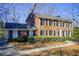 Two-story brick home with landscaping and walkway at 882 Edgewater Trl, Atlanta, GA 30328