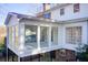 Sunroom addition with deck overlooking wooded area at 882 Edgewater Trl, Atlanta, GA 30328