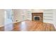 Gathering room with hardwood floors, fireplace, built-ins at 882 Edgewater Trl, Atlanta, GA 30328