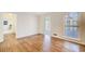 Gathering room with hardwood floors and access to sunroom at 882 Edgewater Trl, Atlanta, GA 30328