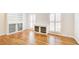 Living room featuring hardwood floors and built-in storage at 882 Edgewater Trl, Atlanta, GA 30328