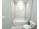 Bathroom with a bathtub and marble tile at 1031 Robert Smalls Way, Atlanta, GA 30318