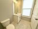 Modern bathroom with white vanity and marble floor at 1031 Robert Smalls Way, Atlanta, GA 30318