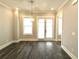 Bright dining room features hardwood floors and French doors at 1031 Robert Smalls Way, Atlanta, GA 30318