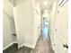 Bright hallway with hardwood floors and access to bedrooms at 1031 Robert Smalls Way, Atlanta, GA 30318