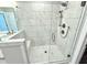 Large walk-in shower with marble tile and bench at 1031 Robert Smalls Way, Atlanta, GA 30318