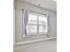 Well-lit bedroom featuring a large window and neutral decor at 2071 Glenview Park Cir, Duluth, GA 30097