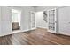 Bright bonus room with wood-look floors and French doors leading to a full bathroom at 2071 Glenview Park Cir, Duluth, GA 30097