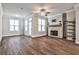 Spacious living room with hardwood floors, fireplace and built-in shelving at 2071 Glenview Park Cir, Duluth, GA 30097