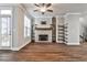 Living room features a stone fireplace, hardwood floors and built-in shelving at 2071 Glenview Park Cir, Duluth, GA 30097