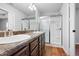 Bathroom with double sinks, dark cabinets, shower and glass door at 4116 Mars Bay # 27, Acworth, GA 30101