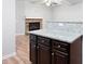 Kitchen with granite countertop and view of a gas fireplace at 4116 Mars Bay # 27, Acworth, GA 30101