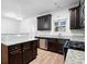 Open kitchen featuring stainless steel appliances, granite countertops, and dark wood cabinets at 4116 Mars Bay # 27, Acworth, GA 30101