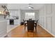 Dining room with dark brown table and chairs, hardwood floors at 900 Sage Nw Ln, Conyers, GA 30012