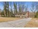 House exterior view showing driveway and landscaping at 900 Sage Nw Ln, Conyers, GA 30012