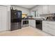 Kitchen with stainless steel appliances and light grey cabinets at 900 Sage Nw Ln, Conyers, GA 30012