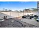The backyard features a brick patio, a covered seating area, and a high fence for added privacy at 102 Prestwick S Way, Stockbridge, GA 30281