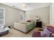 Cozy bedroom featuring a comfortable bed, bedside table, and ample natural light at 102 Prestwick S Way, Stockbridge, GA 30281