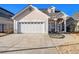 Charming home boasts a well-manicured lawn, a two-car garage, and a stucco exterior at 102 Prestwick S Way, Stockbridge, GA 30281
