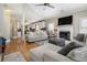 Spacious living room features a fireplace, high ceilings and flows into a modern kitchen at 102 Prestwick S Way, Stockbridge, GA 30281