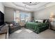 Spacious main bedroom featuring tray ceiling, plush carpeting, and ample natural light at 102 Prestwick S Way, Stockbridge, GA 30281