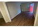 Living room with hardwood floors and a red door at 1876 Selwyn Dr, Decatur, GA 30035