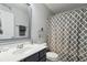 Stylish bathroom featuring gray vanity, patterned shower curtain, and modern fixtures at 245 Fern Crest Dr, Lawrenceville, GA 30046