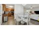 Light-filled dining area adjacent to kitchen, complete with chandelier and wood flooring at 245 Fern Crest Dr, Lawrenceville, GA 30046