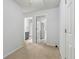 Upstairs hallway with view into a bathroom with a gray vanity at 245 Fern Crest Dr, Lawrenceville, GA 30046