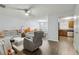 Open-concept living room with modern furniture and hardwood floors at 245 Fern Crest Dr, Lawrenceville, GA 30046