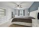 Main bedroom features a ceiling fan, window with curtains, and a dresser at 245 Fern Crest Dr, Lawrenceville, GA 30046