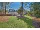 Spacious backyard with grassy area and mature trees at 40 Rhodes Dr, Marietta, GA 30068