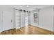 Spacious bedroom with built-in shelving and hardwood floors at 40 Rhodes Dr, Marietta, GA 30068