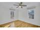 Well-lit bedroom featuring hardwood floors and ceiling fan at 40 Rhodes Dr, Marietta, GA 30068