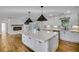 Modern kitchen with large island, white cabinets, and quartz countertops at 40 Rhodes Dr, Marietta, GA 30068