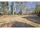 Large backyard with mature trees and garden space at 5352 Waterford Dr, Dunwoody, GA 30338