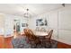 Dining room with hardwood floors, a wood table and view into the kitchen at 5352 Waterford Dr, Dunwoody, GA 30338