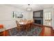 Bright dining room featuring a wood table, fireplace, and access to a patio at 5352 Waterford Dr, Dunwoody, GA 30338