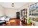 Cozy Gathering room with hardwood floors, a futon, and built-in shelving at 5352 Waterford Dr, Dunwoody, GA 30338