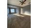 Bright and spacious bedroom with ceiling fan and large windows at 608 Morgans Trce, Ellenwood, GA 30294