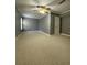 Large bedroom with neutral walls and carpet at 608 Morgans Trce, Ellenwood, GA 30294