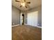 Bedroom with carpet, ceiling fan and access to bathroom at 608 Morgans Trce, Ellenwood, GA 30294