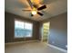 Bright bedroom with closet and ceiling fan at 608 Morgans Trce, Ellenwood, GA 30294