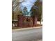 Huntcliff community entrance with brick pillars and sign at 608 Morgans Trce, Ellenwood, GA 30294