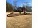 Landscaped yard with brick border and a view of the house at 608 Morgans Trce, Ellenwood, GA 30294