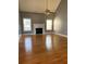 Spacious living room with hardwood floors and a fireplace at 608 Morgans Trce, Ellenwood, GA 30294