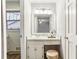 Charming bathroom with vanity, sink, and large mirror at 763 Windy Sw Dr, Stone Mountain, GA 30087