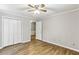 Spacious bedroom with hardwood floors and double door closet at 763 Windy Sw Dr, Stone Mountain, GA 30087